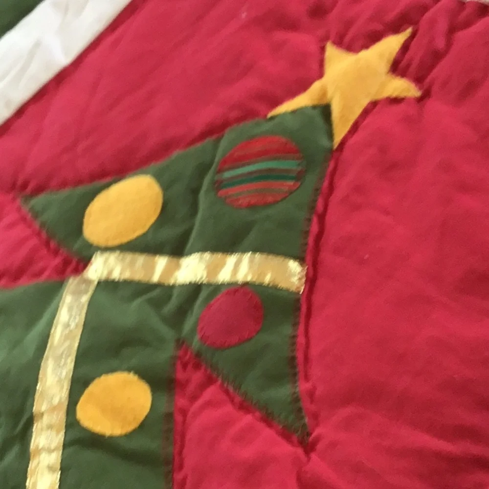 Handmade Christmas-themed applique quilt